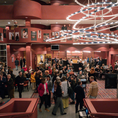 The foyer of the Schauspiel Hannover during the festival opening, with numerous visitors standing around and chatting.